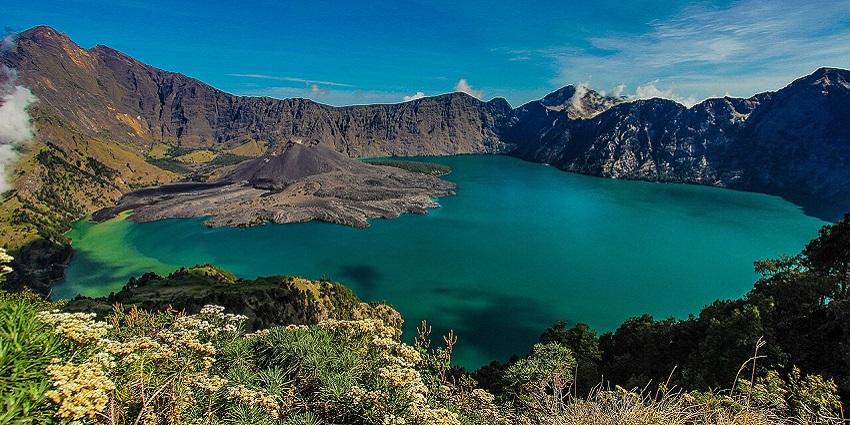 Segara Anak lake with the Barujari volcanic cone inside the Rinjani caldera